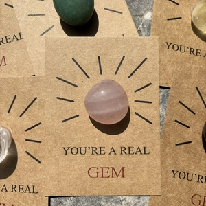 Close-up of pink round crystal on 'YOU'RE A REAL GEM' brown kraft paper greeting card