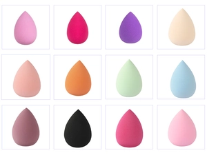 Set of twelve multi-colored teardrop makeup sponges in various vibrant shades and colors