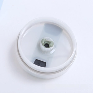 Detail view of the 40oz tumbler lid with green sliding lock and black silicone seal ring