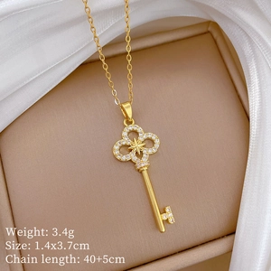 Detail showing golden key necklace weight 3.4g and dimensions 1.4x3.7cm with measurements