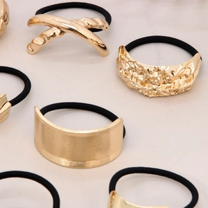 Elegant gold metal bow hair ties with high elasticity black bands for versatile styling