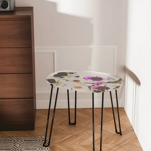 Modern floral round side table with white floral pattern top and black hairpin legs