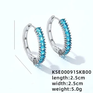 Minimalist silver circular earrings with blue zircon rectangle stones, 2.5cm diameter