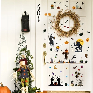 Detailed Halloween wall stickers featuring pumpkin lanterns and bats on a white door