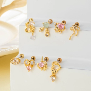 Gold heart and butterfly stud earring set with zircon inlays on display stand