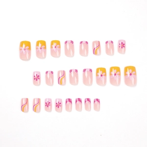 French press-on nails set featuring yellow patterns and pink floral designs on square oval shape