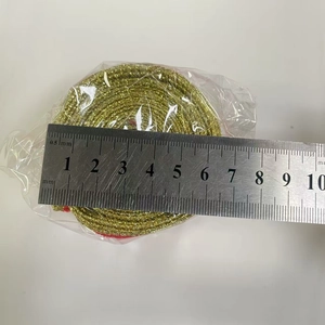 Detail of gold glitter ribbon roll with measuring scale for Christmas tree decoration