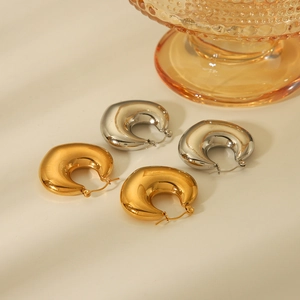 Polished hollow heart hoop earrings in gold and silver finishes for women