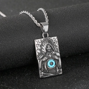 Detail of gothic reaper pendant with striking blue evil eye and twisted chain link