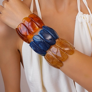 Detailed close-up showing marbled resin texture and bold rectangular links of the bracelet