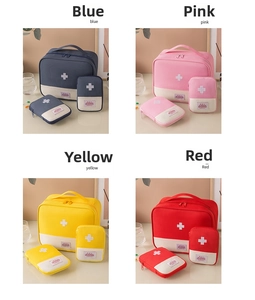 Macro view of portable medical bags in four colors with embroidered cross health symbol