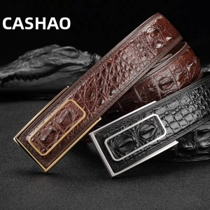 Detailed view of crocodile texture leather belts with premium gold and silver buckles