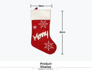 Detail of red Christmas stocking with 20x46cm size dimensions and white plush cuff