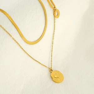 Double-layered gold stainless steel necklace with flat snake chain and heart pendant