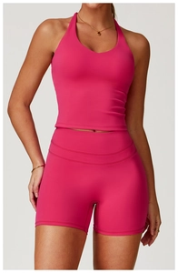 Close-up of rose pink crisscross yoga vest and high-waist fitness shorts with flatlock seams