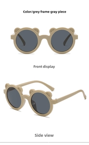 Detail view of bear-eared kids sunglasses with grey frames and round lenses