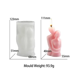 Hugging couple silicone candle mold with finished pink wax statue in side-by-side view