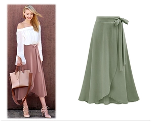 Detail of high waist wrap midi skirt featuring adjustable waist tie and side slit detail