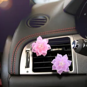 Sparkling crystal lotus car air vent clip decorations in pink and purple colors