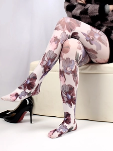 Detailed view of floral printed white tights featuring vintage purple and brown patterns