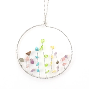 Detailed view of handmade copper wire Tree of Life pendant with colorful crystal stones