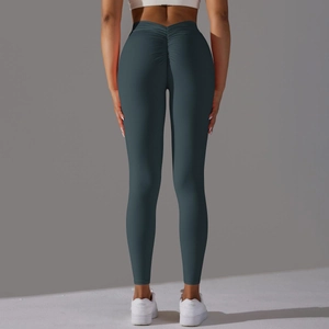 Détail du legging de yoga taille haute avec design scrunch butt lift en bleu sarcelle