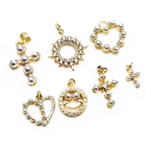 Set of gold metal charms with pearls and rhinestones in cross, heart and smiley shapes