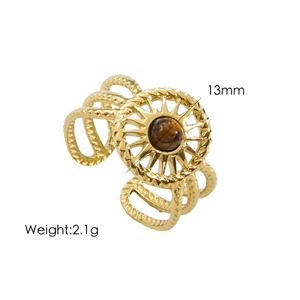 Close-up of golden sunburst ring featuring 13mm brown stone and multi-layer hollow design