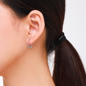 Elegant S925 silver hoop earrings featuring rainbow micro-pave crystals on a model