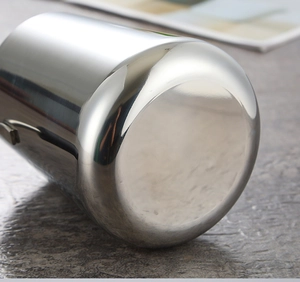 Close-up of a thickened stainless steel milk pan bottom with smooth polished metal finish