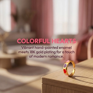 Detailed macro of 18K gold plated ring with colorful hand-painted enamel hearts