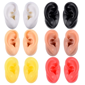Set of six pairs of silicone ear models in multiple skin tones for earring jewelry display
