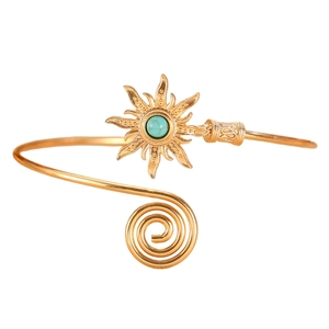 Vintage golden sun arm cuff with turquoise stone and spiral adjustable opening