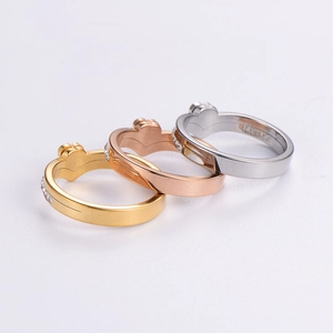 Set of gold rose gold and silver interlocking heart rings with zircon stones