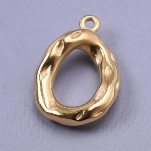 Macro shot of 18k gold plated stainless steel teardrop pendant with textured surface