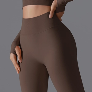 Detail view of coffee high waist yoga leggings with ribbed waistband and seamless texture