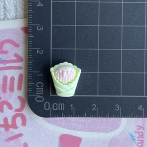 Detailed view of mini resin cupcake charm showing 1.5cm height scale for DIY crafts