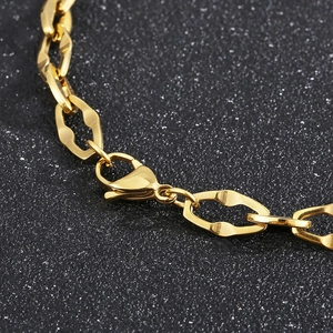 Detail of titanium steel lip chain necklace with gold finish and lobster clasp closure