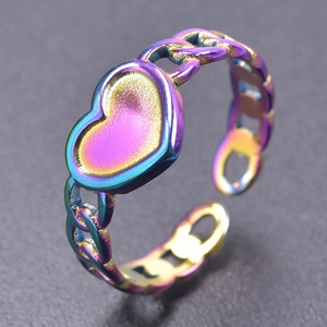 Macro shot of rainbow-colored heart ring with chain-style band and adjustable opening