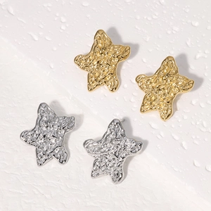 Polished gold and silver star stud earrings with irregular wrinkled metal texture