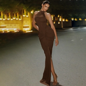 Detail of dark brown sleeveless maxi dress featuring elegant waist pleats and high side slit