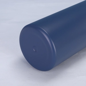 Close-up of the smooth matte dark blue base of a stainless steel insulated water bottle