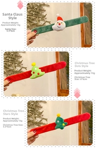 Detailed view of Christmas slap bracelets featuring plush Santa and tree ornaments