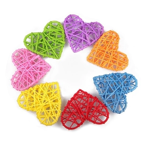 Colorful heart-shaped wicker ornaments arranged in a circle for wedding and event decor