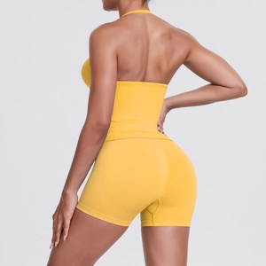 Detail of seamless yellow yoga set back design showing racerback top and high waist shorts
