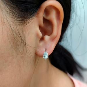Elegant silver-toned teardrop earrings featuring a pear-cut clear crystal for women