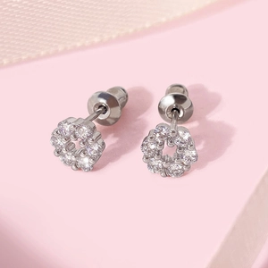 Elegant flower-shaped copper stud earrings with white zircons and silver plating