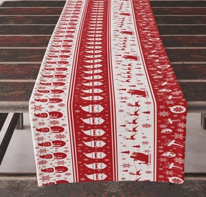 Detail of Christmas table runner with Santa and snowman patterns on rustic wood background