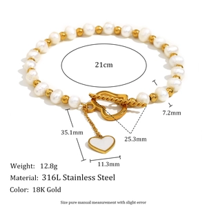 Detailed view of 18K gold plated stainless steel heart clasp and pearl bead bracelet