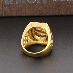 Macro shot of gold hip-hop horse ring with hollow side details and polished finish